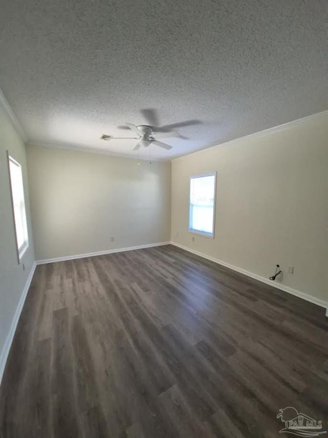 2008 Augusta Ave, Pensacola, FL 32507 - empty room featuring dark wood-style floors, a textured ceiling, ornamental molding, ceiling fan, and baseboards