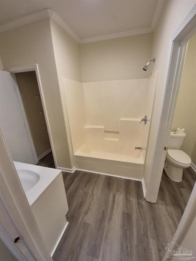 2008 Augusta Ave, Pensacola, FL 32507 - full bath with wood finished floors, ornamental molding, toilet, baseboards, and shower / washtub combination