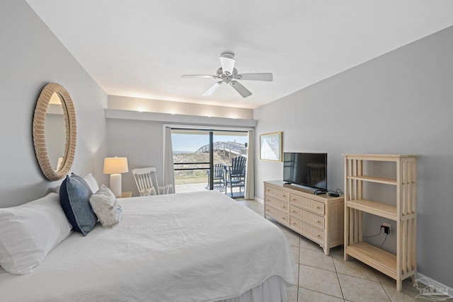 bedroom featuring light tile patterned floors, baseboards, access to exterior, and a ceiling fan