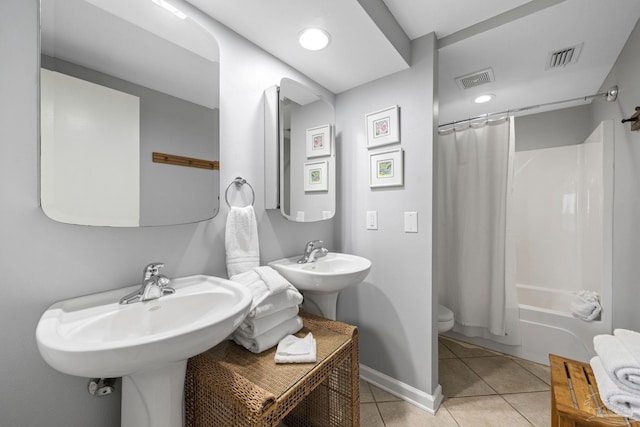 full bath featuring tile patterned flooring, toilet, baseboards, and visible vents