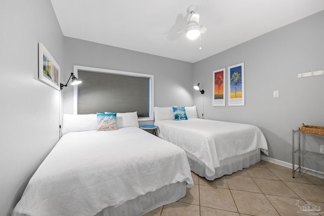 bedroom with baseboards, a ceiling fan, and tile patterned flooring