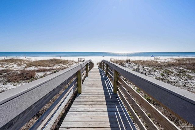 surrounding community featuring a view of the beach and a water view