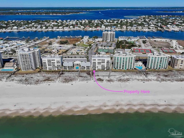 birds eye view of property with a view of city and a water view