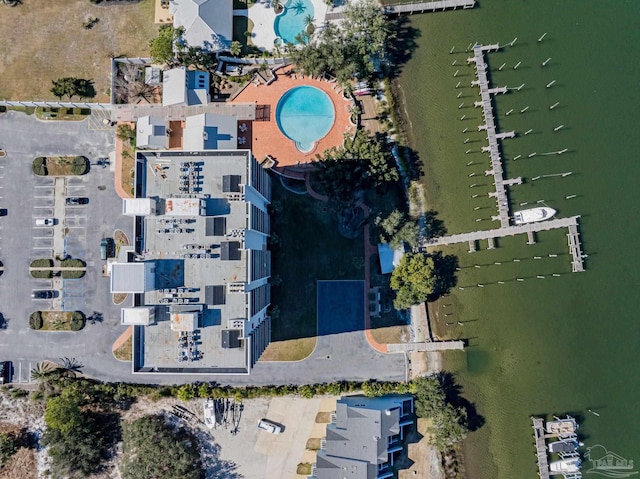 birds eye view of property with a water view