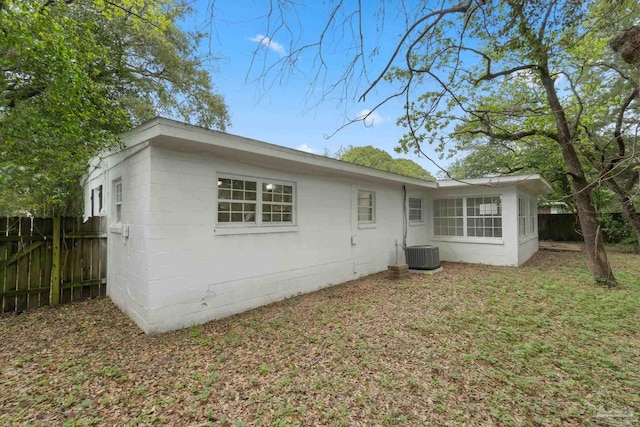 4514 Florelle Way, Pensacola, FL 32505 - back of property featuring concrete block siding, fence, central AC, and a yard