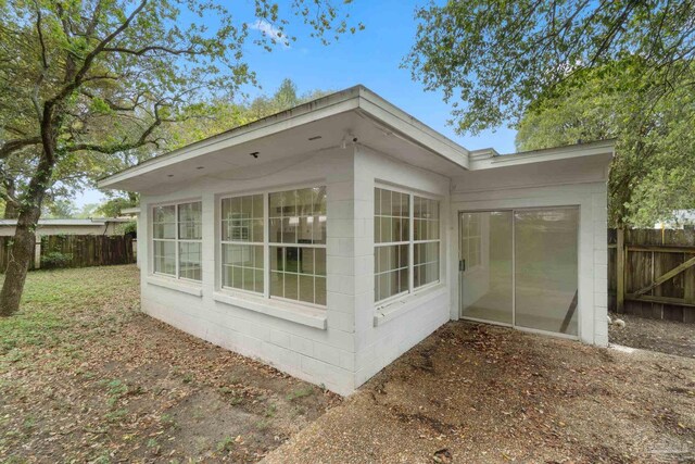 4514 Florelle Way, Pensacola, FL 32505 - view of home's exterior featuring fence and concrete block siding