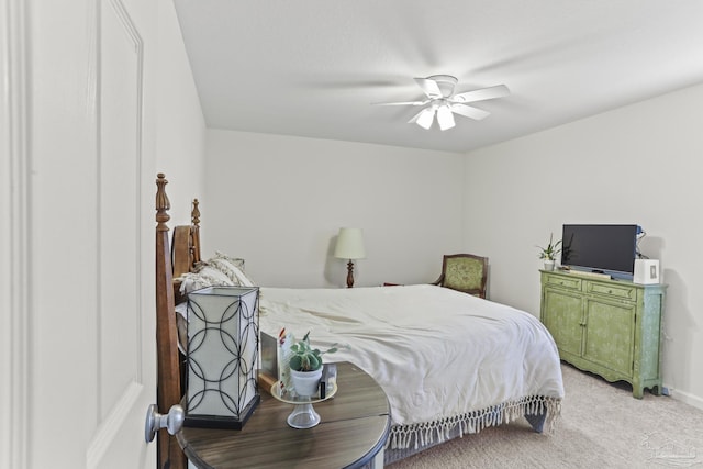 bedroom with ceiling fan, baseboards, and carpet flooring