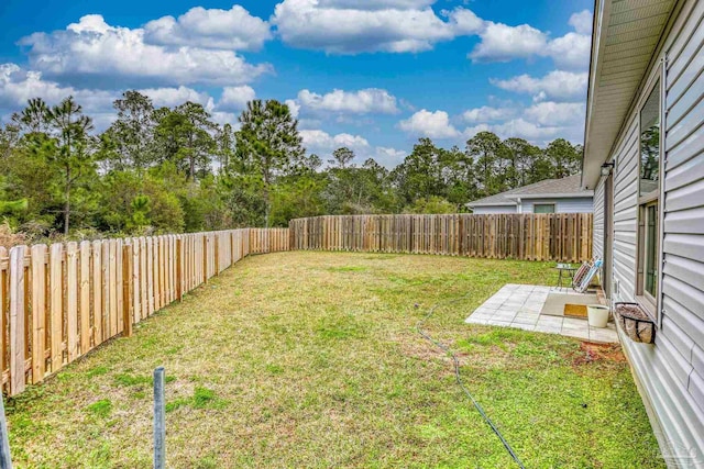 view of yard featuring a fenced backyard and a patio