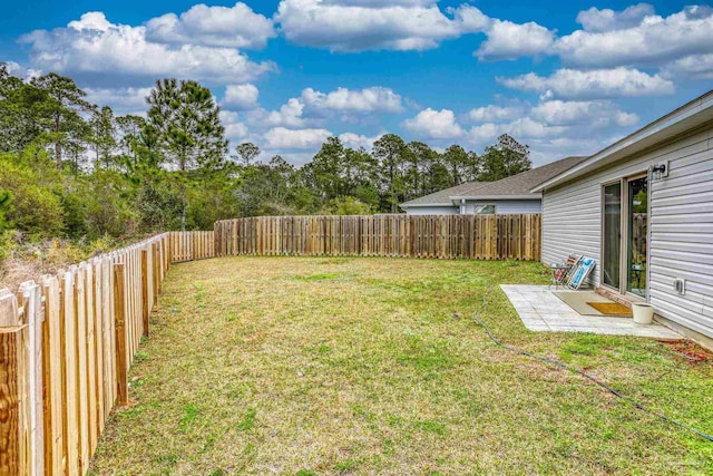 view of yard with a fenced backyard and a patio