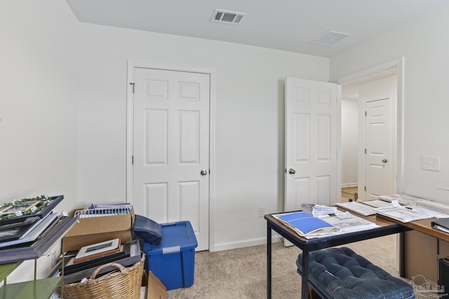 office area featuring carpet, visible vents, and baseboards