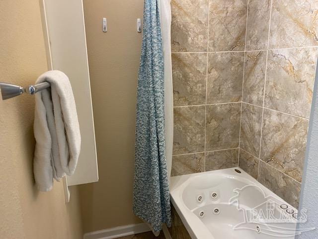 bathroom with shower / bathtub combination with curtain