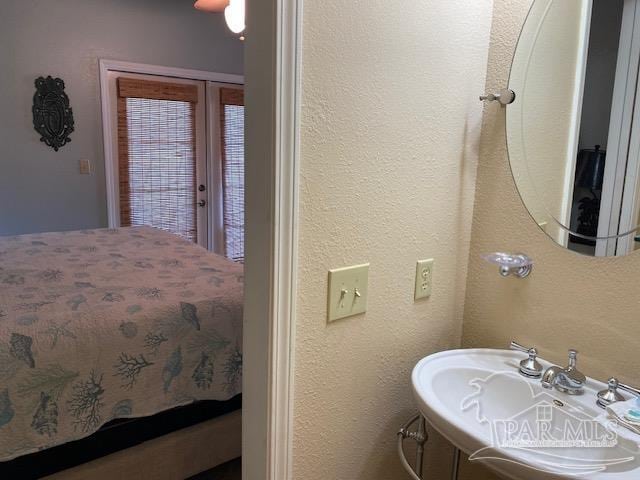 interior space with french doors and sink