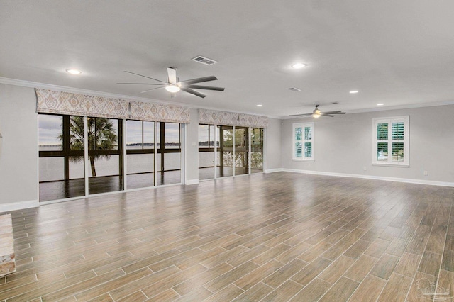 unfurnished room with ornamental molding and ceiling fan