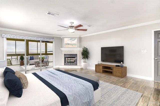 bedroom featuring ceiling fan, ornamental molding, access to exterior, and light hardwood / wood-style flooring