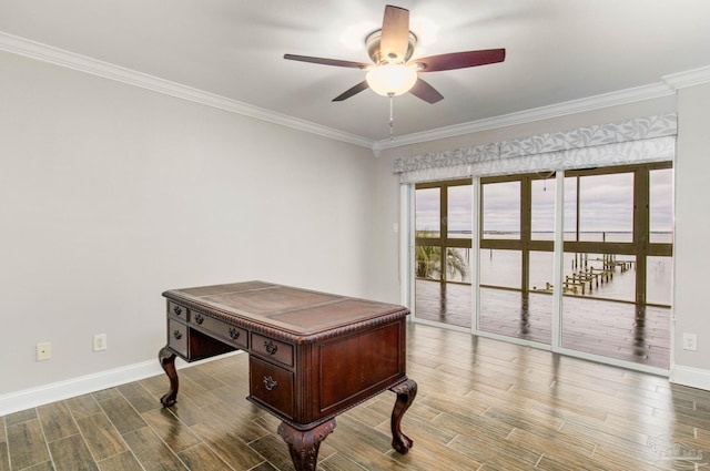 office featuring ornamental molding, ceiling fan, and a water view