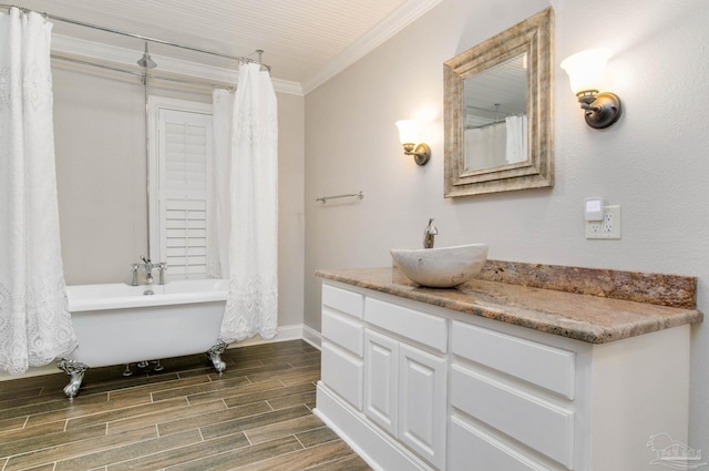 bathroom featuring crown molding and vanity