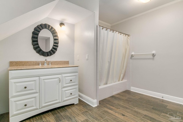 bathroom featuring crown molding, vanity, and shower / bath combo