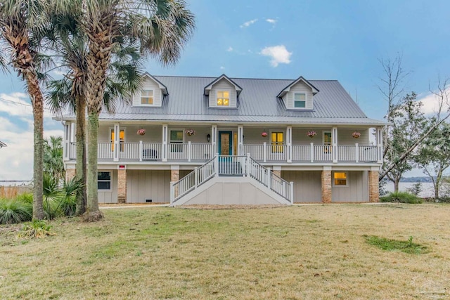 view of front of property featuring a front yard and covered porch