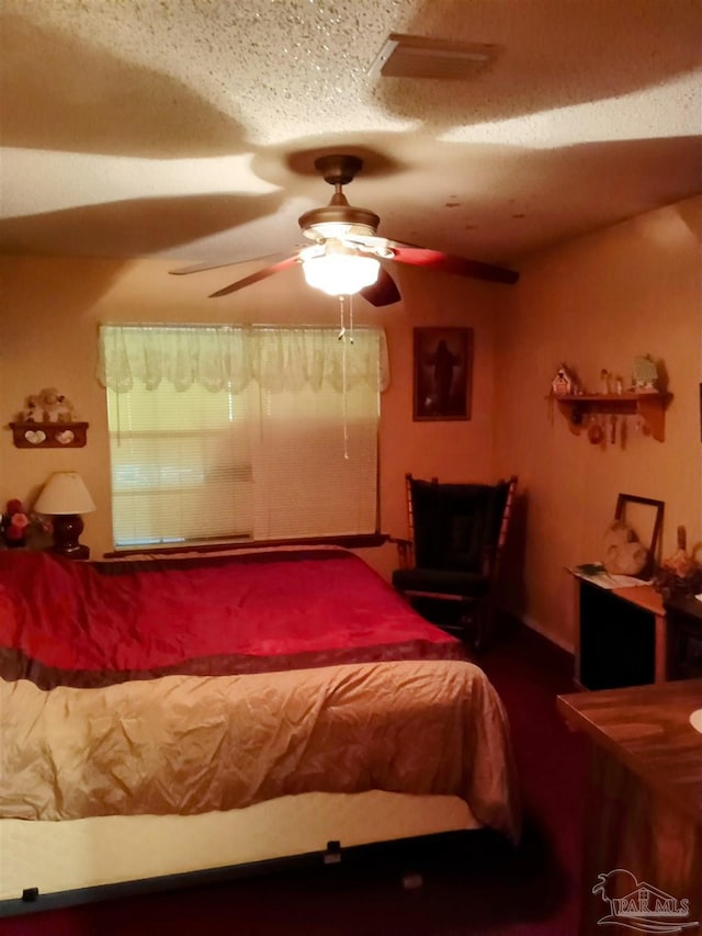 4801 Berryhill Rd, Milton, FL 32570 - bedroom featuring a ceiling fan and a textured ceiling