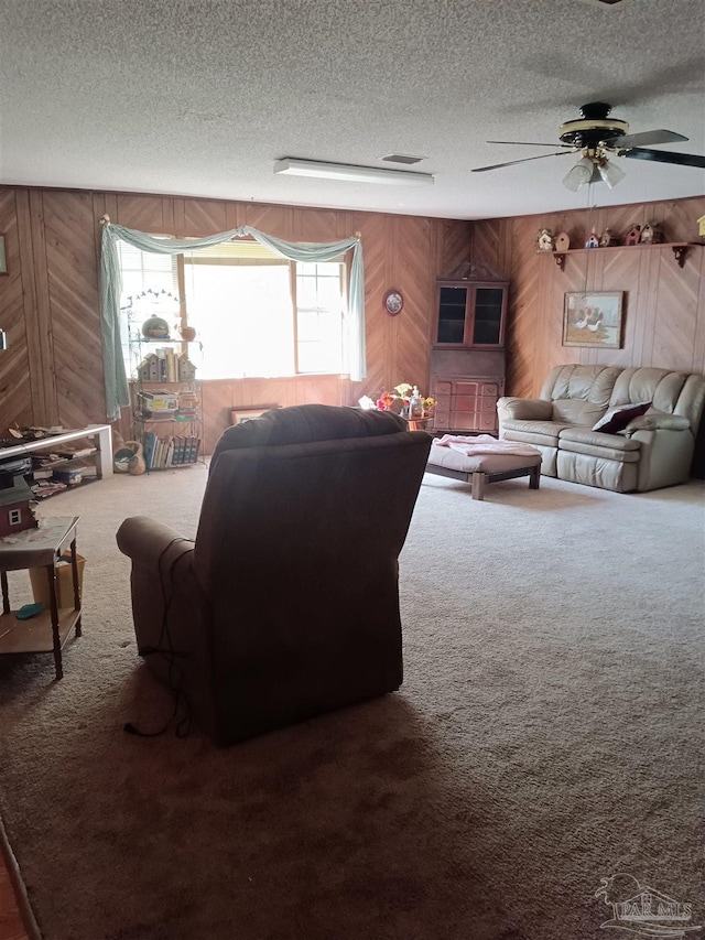 4801 Berryhill Rd, Milton, FL 32570 - living room with wooden walls, carpet floors, a textured ceiling, and ceiling fan