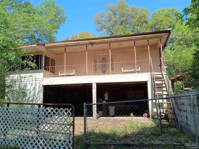4801 Berryhill Rd, Milton, FL 32570 - rear view of property featuring stairs and fence