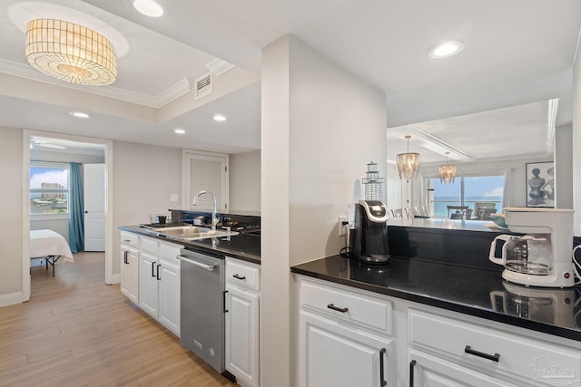 kitchen with white cabinetry, sink, stainless steel dishwasher, crown molding, and light wood-type flooring