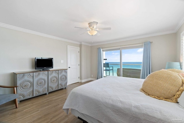 bedroom featuring access to exterior, crown molding, ceiling fan, and wood-type flooring