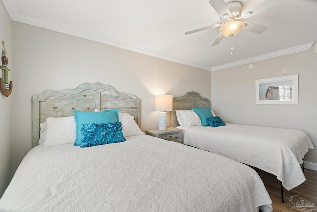 bedroom with wood-type flooring, crown molding, and ceiling fan