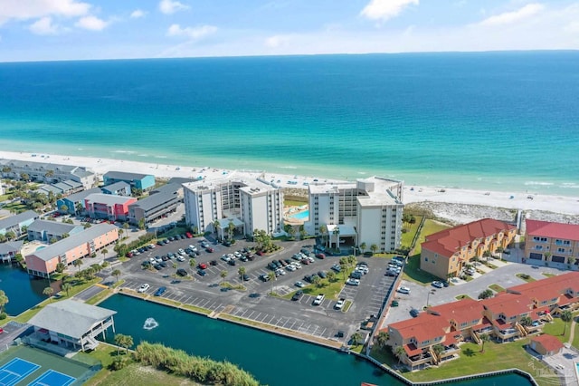 bird's eye view featuring a water view and a beach view