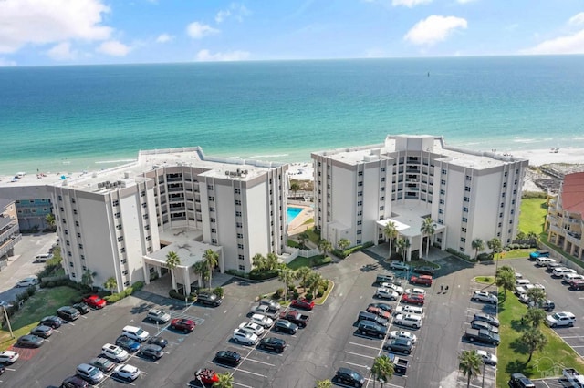 aerial view featuring a water view and a view of the beach