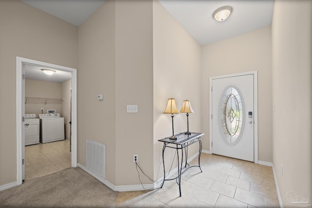 5661 Maggie Rose Cir, Milton, FL 32570 - foyer entrance featuring independent washer and dryer and light tile patterned floors