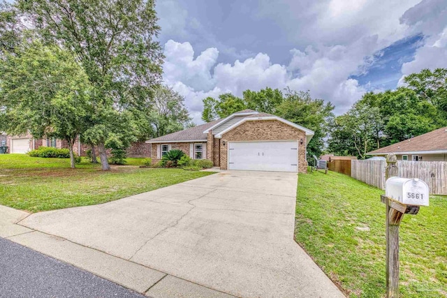 5661 Maggie Rose Cir, Milton, FL 32570 - view of front of property with brick siding, driveway, and an attached garage