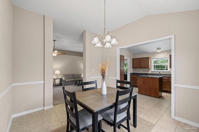 5661 Maggie Rose Cir, Milton, FL 32570 - dining area with light tile patterned floors, lofted ceiling, a chandelier, and ceiling fan