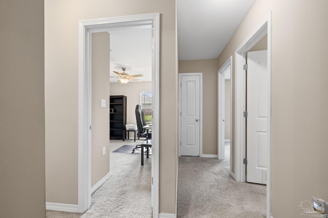 5661 Maggie Rose Cir, Milton, FL 32570 - corridor with a desk and light colored carpet