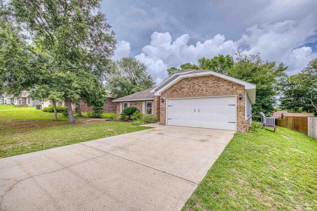 5661 Maggie Rose Cir, Milton, FL 32570 - ranch-style house with brick siding, driveway, and an attached garage