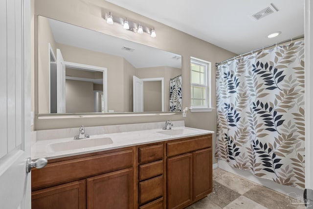 5661 Maggie Rose Cir, Milton, FL 32570 - full bath with double vanity and a shower with shower curtain