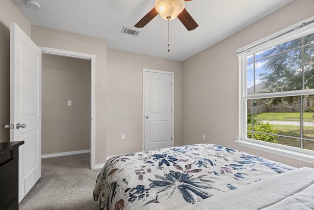 5661 Maggie Rose Cir, Milton, FL 32570 - bedroom with multiple windows, light colored carpet, and a ceiling fan