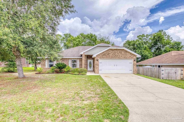 5661 Maggie Rose Cir, Milton, FL 32570 - single story home with brick siding, an attached garage, and concrete driveway