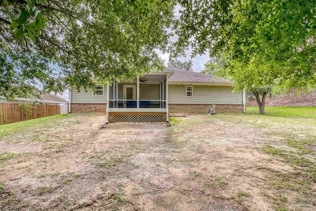 5661 Maggie Rose Cir, Milton, FL 32570 - back of property featuring a sunroom and ceiling fan