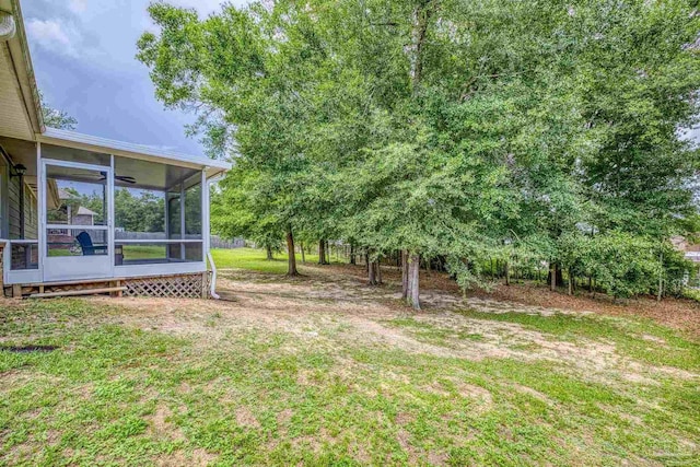 5661 Maggie Rose Cir, Milton, FL 32570 - view of green lawn with a sunroom