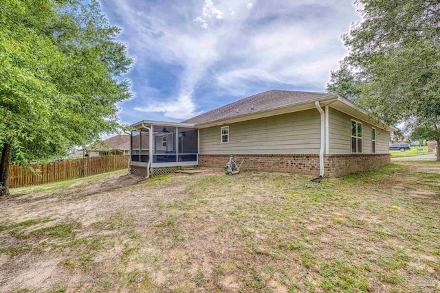 5661 Maggie Rose Cir, Milton, FL 32570 - rear view of house with a sunroom and brick siding