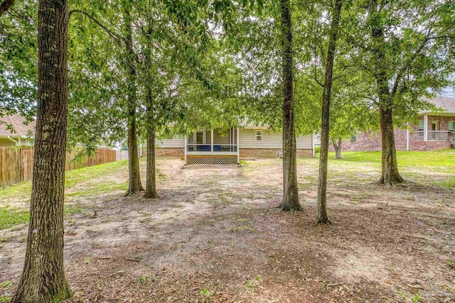 5661 Maggie Rose Cir, Milton, FL 32570 - view of yard with a sunroom