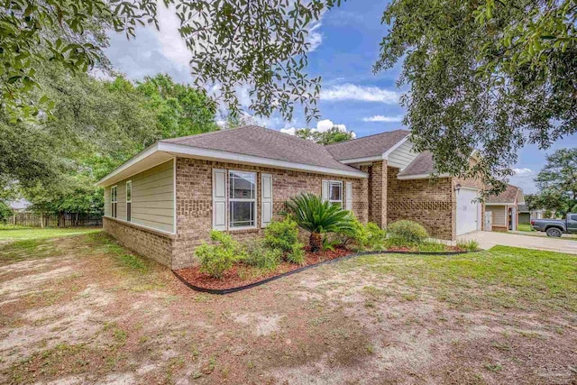 5661 Maggie Rose Cir, Milton, FL 32570 - single story home featuring brick siding, concrete driveway, an attached garage, and a front yard
