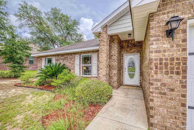 5661 Maggie Rose Cir, Milton, FL 32570 - property entrance featuring brick siding and a shingled roof
