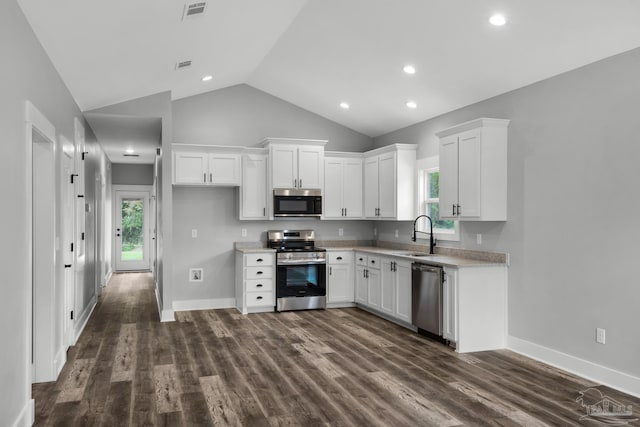 kitchen with visible vents, a sink, white cabinetry, appliances with stainless steel finishes, and light countertops