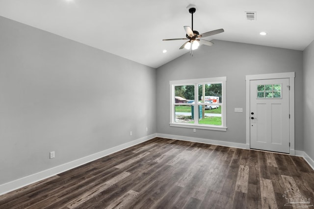 entrance foyer featuring dark wood-style floors, a ceiling fan, visible vents, baseboards, and lofted ceiling