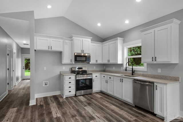 kitchen featuring white cabinets, plenty of natural light, appliances with stainless steel finishes, and a sink