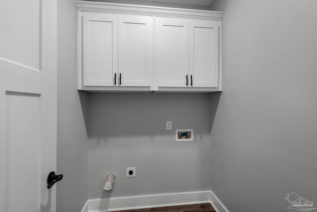 laundry area featuring washer hookup, cabinet space, baseboards, and hookup for an electric dryer