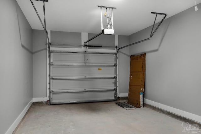 garage featuring baseboards and a garage door opener