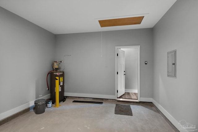 garage featuring electric panel, electric water heater, and baseboards